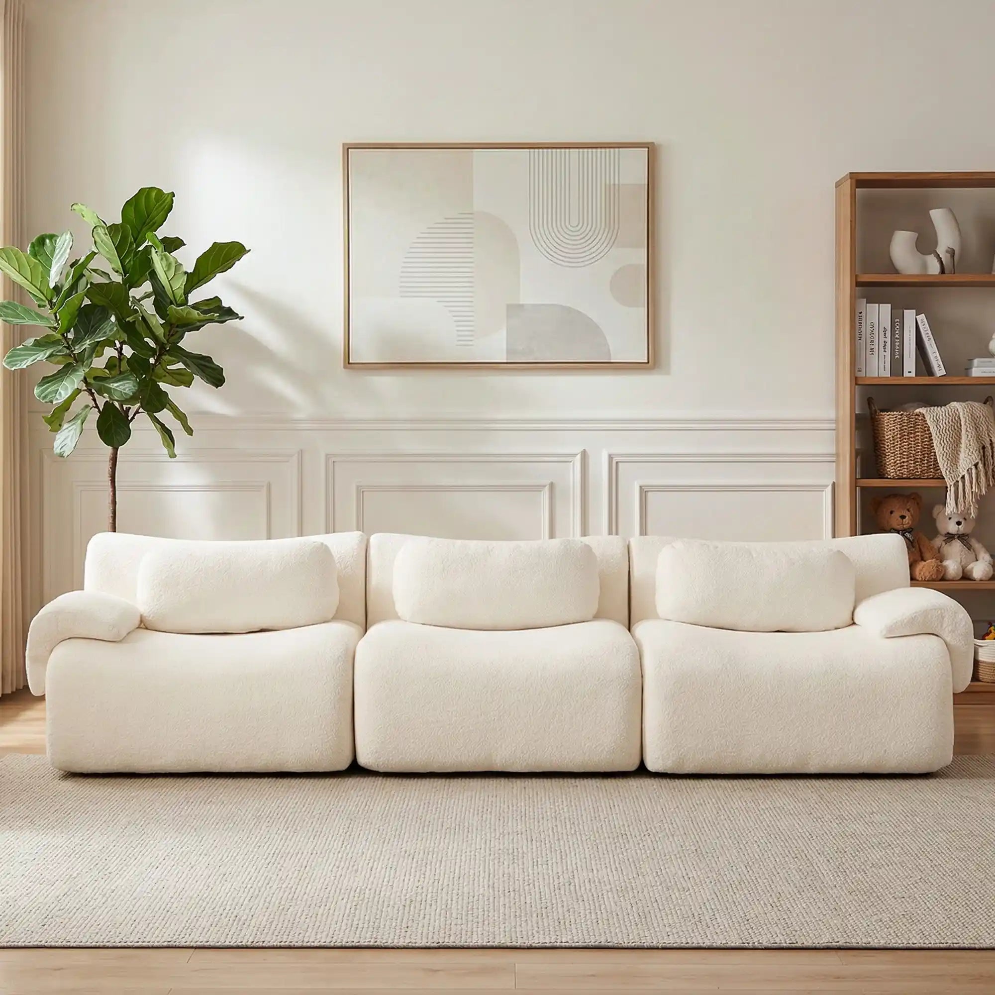Light cream sectional sofa with multiple seat cushions and rounded armrests