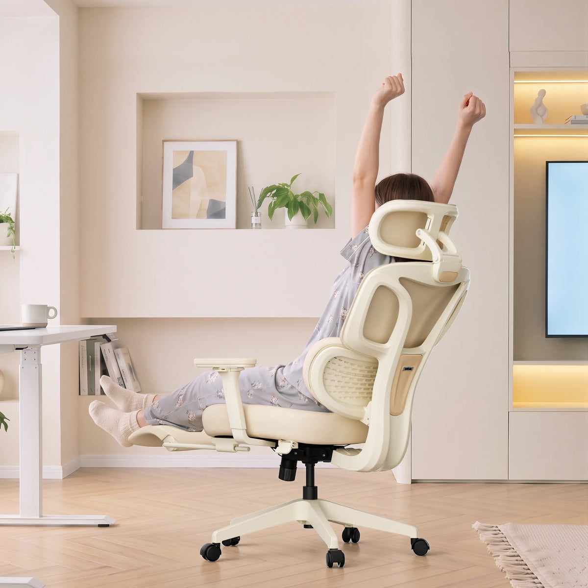 Cream ergonomic office chair with headrest, armrests, and five-point rolling base